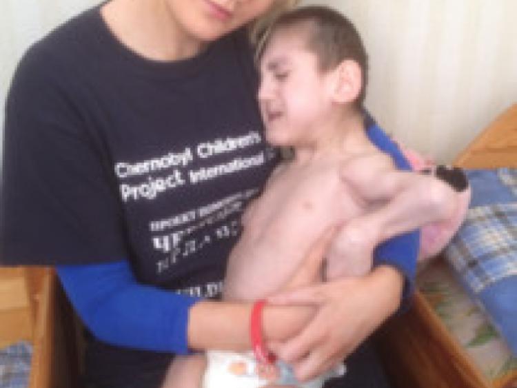 Aughawillan's Niamh Flanagan pictured with one of the orphans at Vesnova Childrens Institution, Chernobyl.