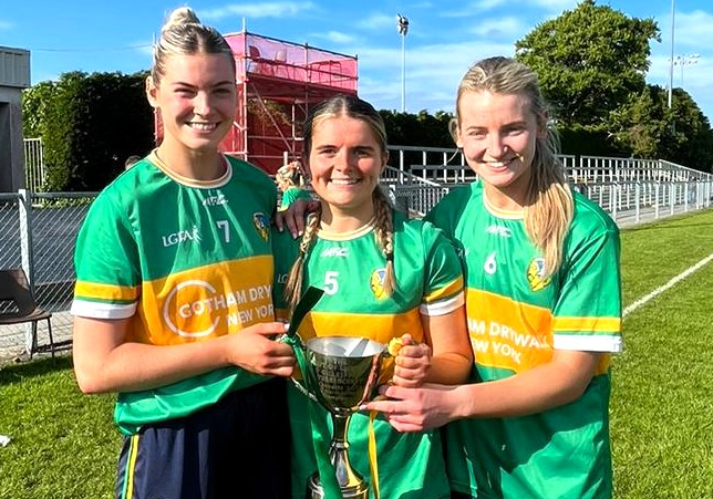 Kasey Bruen (right) pictured with her sister Elise and St Mary's clubmate Sarah Reynolds (centre) and the Gift of Life Cup