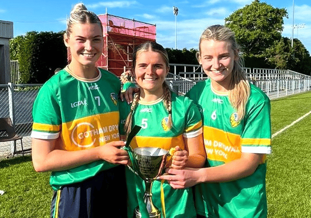 Kasey Bruen (right) pictured with her sister Elise and St Mary's clubmate Sarah Reynolds (centre) and the Gift of Life Cup