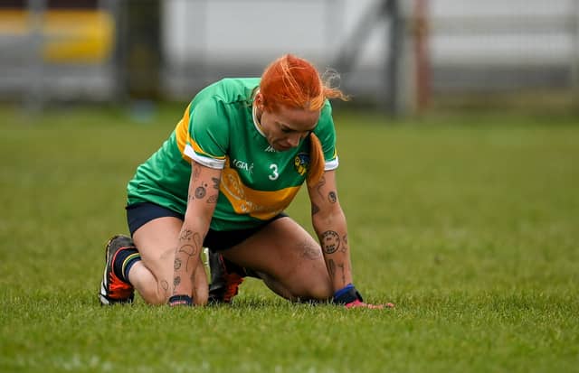 A disappointed Charlene Tyrell slumps to the ground after the final whistle in Woodmount Picture: Seb Daly Sportsfile