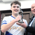 Brian McKenna is presented with the Man of the Match award by Leitrim GAA County Board Chairman Enda Stenson Picture: Willie Donnellan