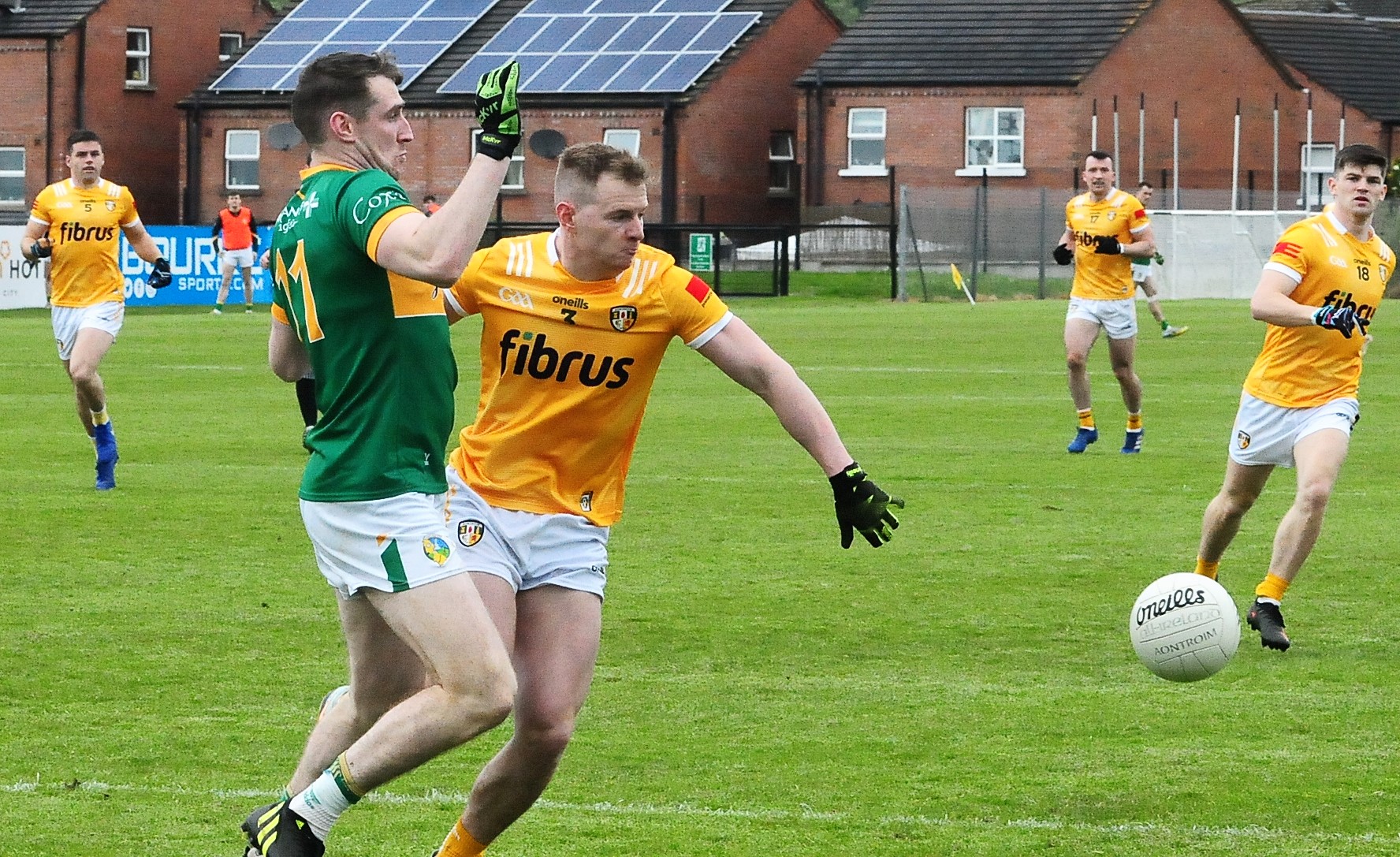 Keith Beirne is tackled by Antrim captain Peter Healy Picture: Willie Donnellan
