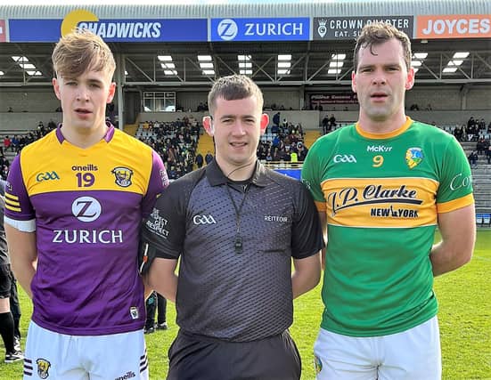 Leitrim captain Donal Wrynn pictured with Wexford's Liam Coleman and referee Fintan Pierce Picture: Leitrim GAA