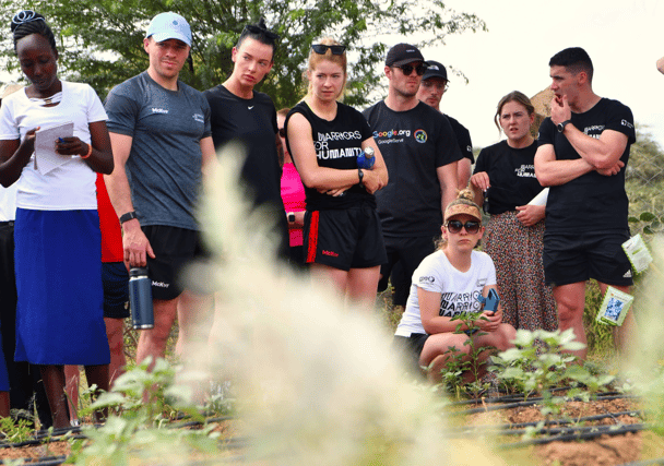 Clare Owens (kneeling) pictured with some of her fellow Warriors for Humanity Plant the Planet players in Kenya last November