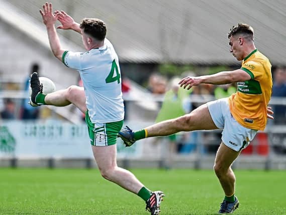 Darragh Rooney strikes for a Leitrim point despite the attempted block from London's Nathan McElwaine last Sunday in McGovern Emerald Park in Ruislip Picture: Sam Barnes Sportsfile