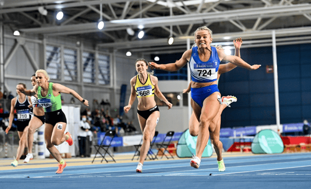 Carlow's Molly Scott dips for the line to set a new Irish record at the National Indoor Arena at the Sports Ireland Campus in Abbotstown last Sunday Picture: Sam Barnes Sportsfile