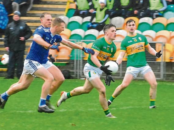 Leitrim's Riordan O'Rourke is put under pressure by Cavan's Jason McLoughlin in the Allianz NFL Division 4 clash Picture: Willie Donnellan