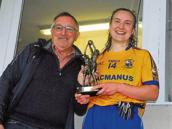 Leitrim LGFA chairperson Aidan Heron presents the Player of the Match award to Ailbhe Clancy Picture: Willie Donnellan