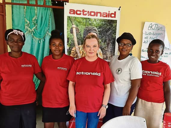 Triona Pender, head of programmes at ActionAid Ireland, with local women's group members in Haiti who are spearheading the earthquake relief response