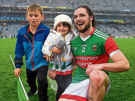 Pádraig O'Hora celebrates with his children Caiden and Mila-Rae after Mayo's victory over Dublin at Croke Park in Dublin Picture Seb Daly Sportsfile