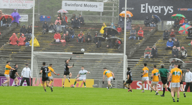 Mayo's Darren McHale rises to fist the ball past Leitrim keeper Brendan Flynn Picture: Willie Donnellan