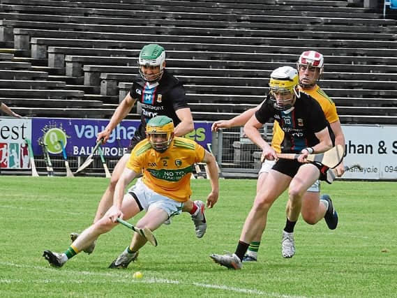 Paul Earley gathers the sliothar under pressure from two Mayo attackers during last Sunday's Nicky Rackard Cup clash in Elvery's Mac Hale Park in Castlebar Picture: Willie Donnellan