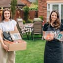 Ellen Wright and Hannah Clarke pictured with one of the hampers