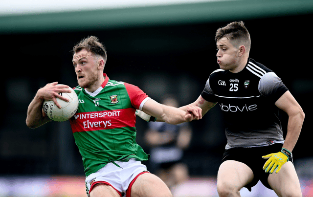 Mayo's Darren McHale gathers the ball ahead of Sligo's Karl McKenna in Markievicz Park Picture: Sportsfile