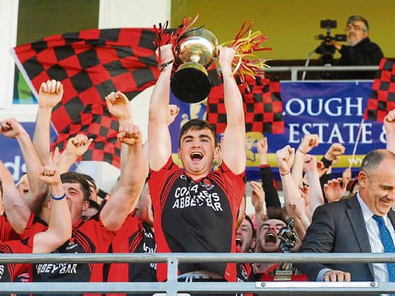 Fenagh captain Ryan O'Rourke raises the Frank Reynolds Memorial Cup aloft. Photo by Willie Donnellan