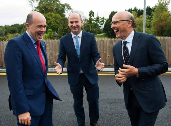 Minister Denis Naughten with Stephen Wheeler, MD SSE Ireland and David C. McCourt, founder of Granahan McCourt Capital and Chairman of enet.