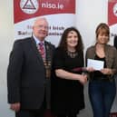 Harry Galvin, (President of NISO), Chris McCormack (Lecturer AIT), Malgorzata Kosel  Award winner, John Flanagan, NISO Midlands Chairperson and Quizmaster holding the booklet Malgorzata designed.
