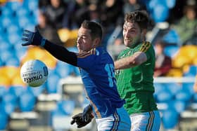 Wicklow's John McGrath is challenged by Leitrim's Fionn Carney during the Allianz League Division 4 clash in Joule Park Aughrim last Sunday.  Photo by Garry O'Neill