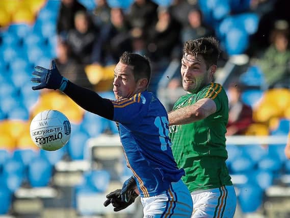 Wicklow's John McGrath is challenged by Leitrim's Fionn Carney during the Allianz League Division 4 clash in Joule Park Aughrim last Sunday. Photo by Garry O'Neill