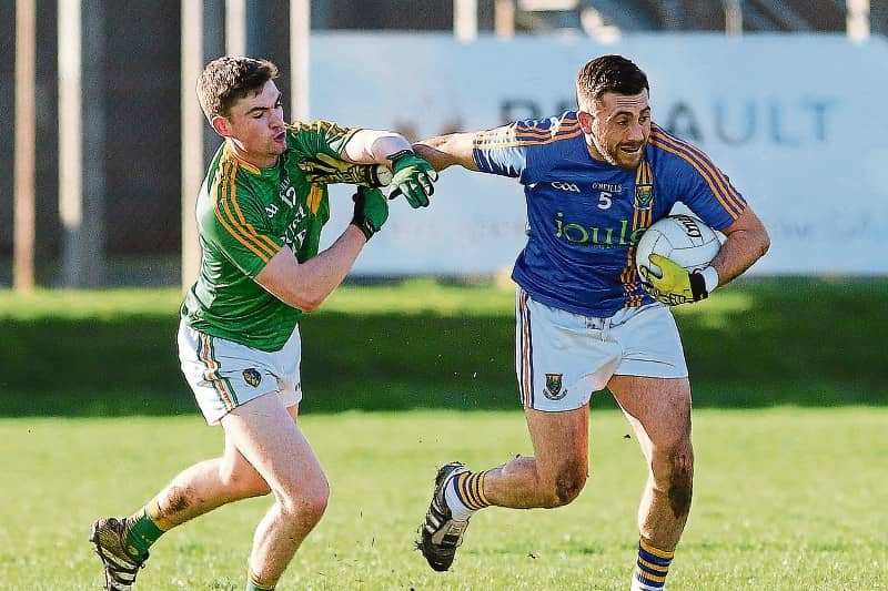 Leitrim's Ryan O'Rourke is held off by Wicklow's Darren Hayden during last Sunday's Allianz League Division 4 clash in Joule Park Aughrim. Photo by Garry O'Neill