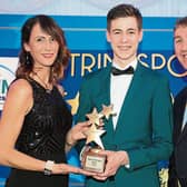 Junior Sport Star of the Year Lee McSharry receives his award from Aoife McCormack of The Landmark Hotel and Leitrim Sports Partnership Co-ordinator Declan Boyle. Photo by James Molloy