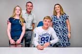 Finn McGreevy signs his Birmingham City FC contract with his parents John and Marie  Claire and sister Ciara