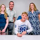 Finn McGreevy signs his Birmingham City FC contract with his parents John and Marie  Claire and sister Ciara