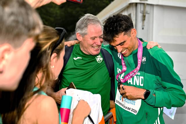 Ballinaglera’s Michael Cornyn congratulates Andrew Coscoran after he was presented with his bronze medal from the men’s 1500m last Saturday at the European Athletics Championships 2026 Picture: Sam Barnes Sportsfile