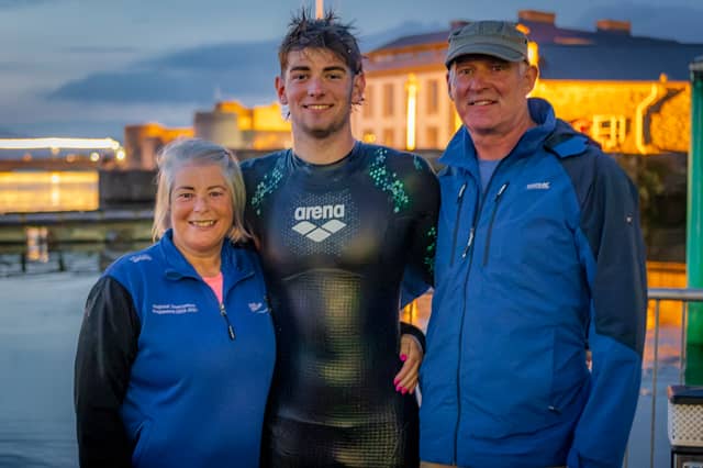 Conor Lanigan pictured with parents Helen Kennedy and Barry Lanigan in Limerick after completing a seven day swim of the River Shannon while raising funds for the Irish Cancer Society.