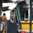 A person walking by a train