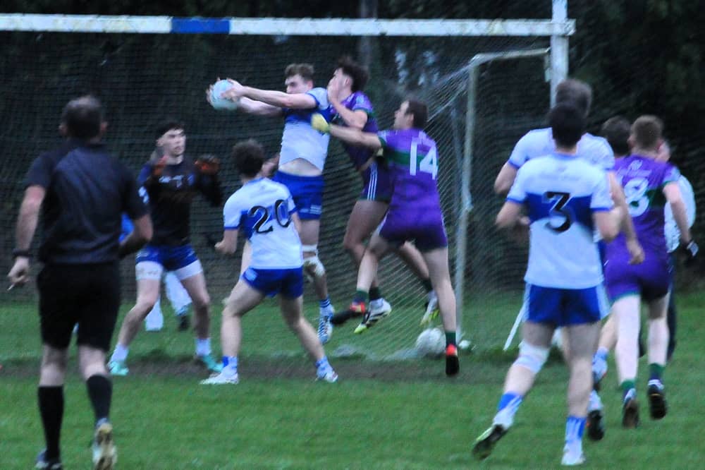 St Mary's Gavin Reynolds fields the ball under pressure in his own goalmouth against Leitrim Gaels Picture: Willie Donnellan