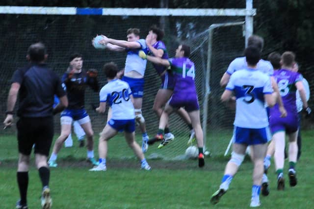 St Mary's Gavin Reynolds fields the ball under pressure in his own goalmouth against Leitrim Gaels Picture: Willie Donnellan