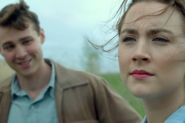 Emory Cohen as "Tony" and Saoirse Ronan as "Eilis" in BROOKLYN. Photo courtesy of Fox Searchlight Pictures. © 2015 Twentieth Century Fox Film