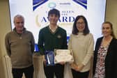 Shane Lowe is pictured receiving his Naughton Scholarship.