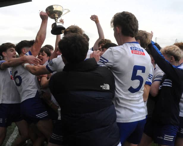 St Mary's players celebrate with the George O'Toole Cup after defeating Annaduff in the Westlink Coaches U17 FC Division 1 Final Picture: Willie Donnellan