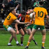Fenagh St Caillin's Oisin McLoughlin is tackled by Ballinamore Sean O'Heslins' Michael McKiernan Picture: Willie Donnellan