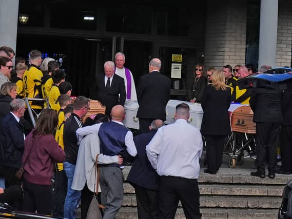 The four coffins of Philip and Kim English and their sons, Jayden and Callum, are carried into Sacred Heart Church Parish Centre in Waterford on Sunday