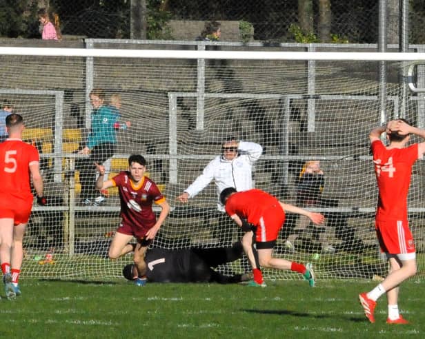 Darren Cox turns in celebration after scoring his team's second goal against St Patrick's Dromahair Picture: Willie Donnellan