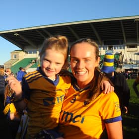 Player of the Match Anna Devaney celebrate with a young Glencar Manorhamilton fan Picture: Willie Donnellan