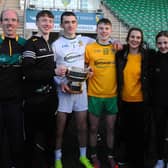 Ballinamore Sean O’Heslin’s Goalkeeper Mark Aherne holding the Fenagh cup with his family after the club's Leitrim Senior Championship Final win on Sunday.  