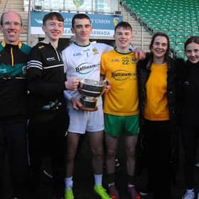 Ballinamore Sean O’Heslin’s Goalkeeper Mark Aherne holding the Fenagh cup with his family after the club's Leitrim Senior Championship Final win on Sunday.  