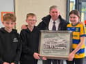  Senior pupils Lauren, Aaron and Jonah present retiring Bus Éireann school bus driver Pat McGarry with an engraved mirror to mark his 19 years of service on the Elphin route.  