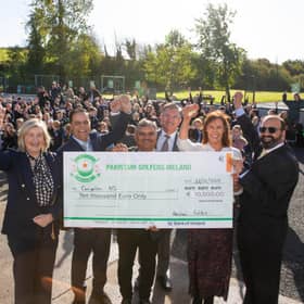 Members of Pakistani Golfers Ireland with staff and pupils at Scoil Mhuire Naofa, Carrigallen.