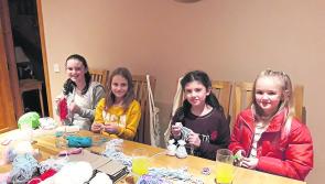 Kate and Rachel win Christmas badges for everyone at their school!