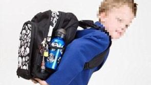 Online warning to parents not to have child's name visible on school bag 