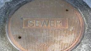 Man hole lid being "lifted" by rains