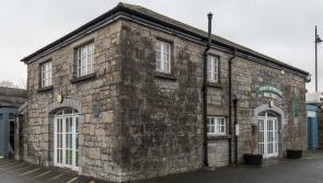 Historic Old Barrel Store in Carrick flooded, clean-up underway