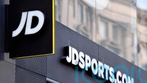 Popular sportswear company posts record profits but warns economic woes will hold back growth