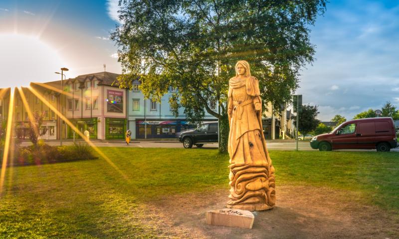 Autumn light on new sculpture of St. Eidin in Carrick