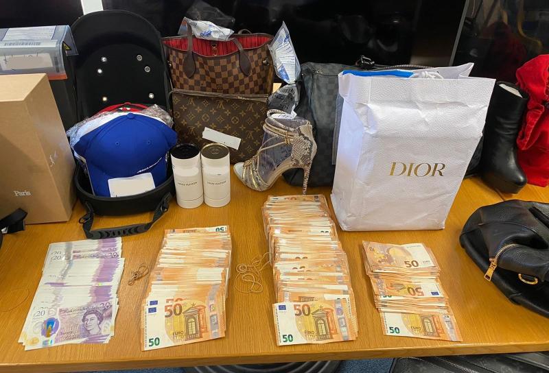 Rolex watches, designer clothes and champagne among the near-150 high end goods seized in garda raid